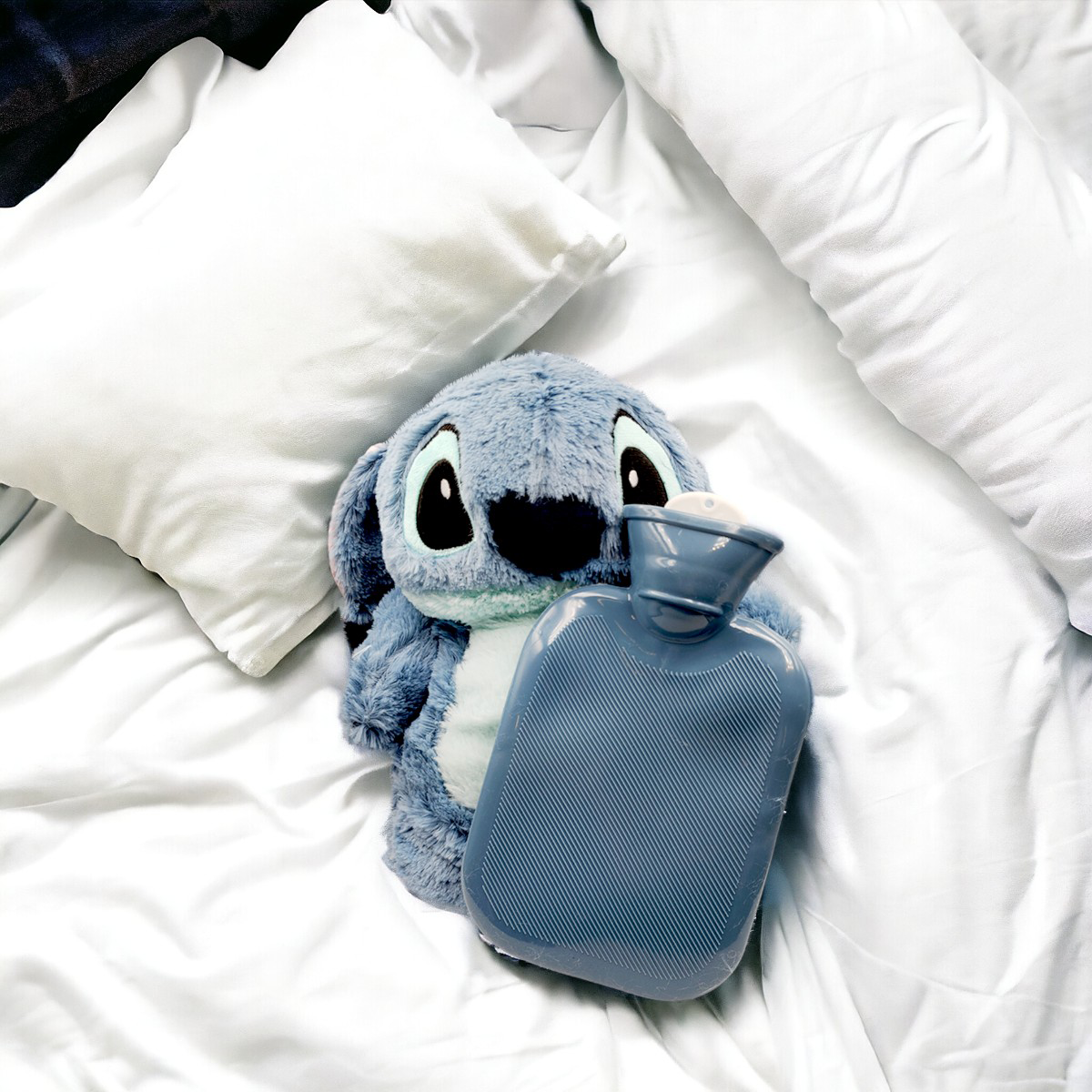 Peluche Stitch con botellita para agua caliente - cólicos