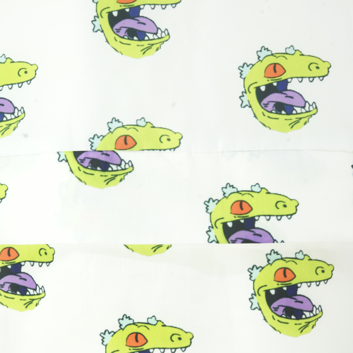 Chamarra rompevientos con cangurera y gorro Reptar